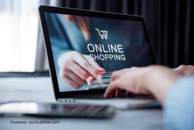 E-commerce and online shopping concept, Woman hand using laptop (Mockup website) and holding credit card for shopping payment online at home