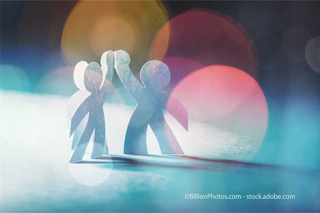 Circle of paper people on abstract background