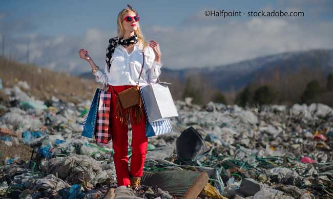Modern woman on landfill, consumerism versus pollution concept