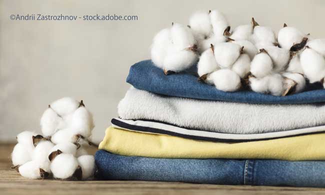 A stack of organic clothing and cotton colors. Eco friendly fabric shop
