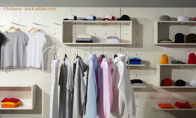 TPastel white, gray, blue and pink cotton sportswear on a rail in the store