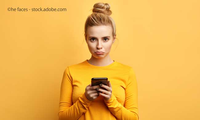 sad woman with smartphone
