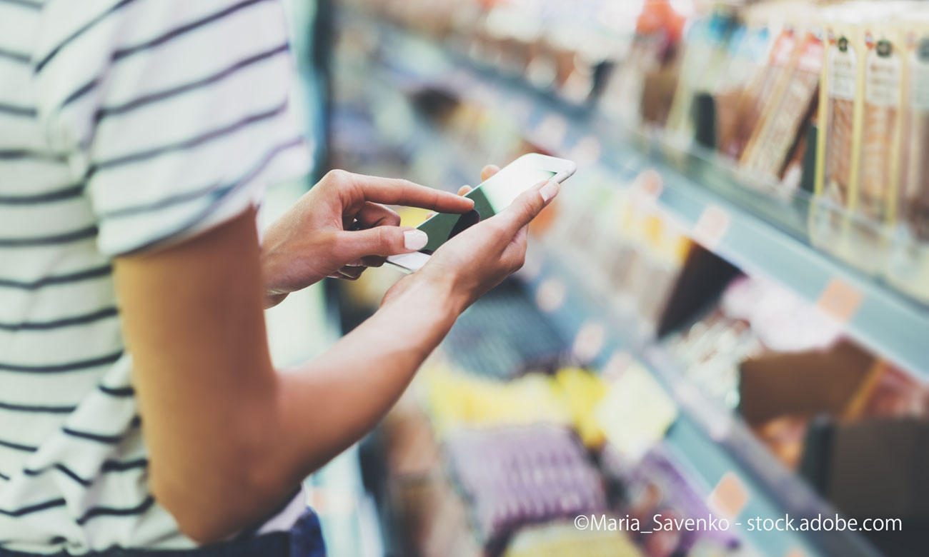 image of using digital gadget in store