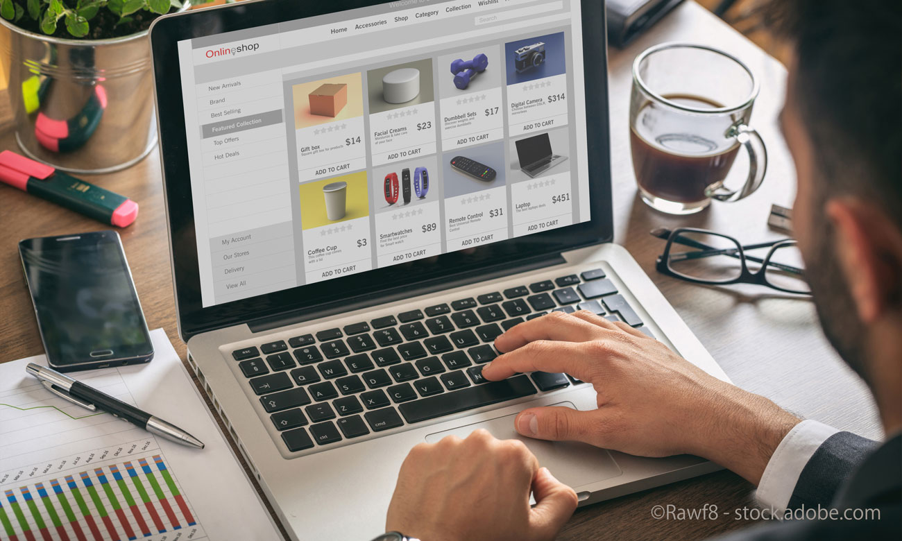 Online shop website developer working with a laptop