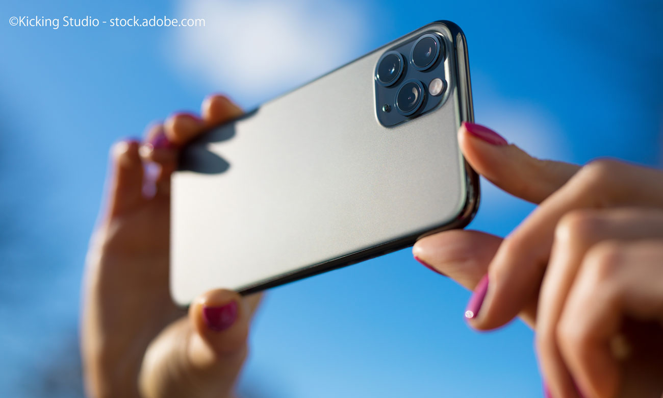 Person holding in hands modern smartphone