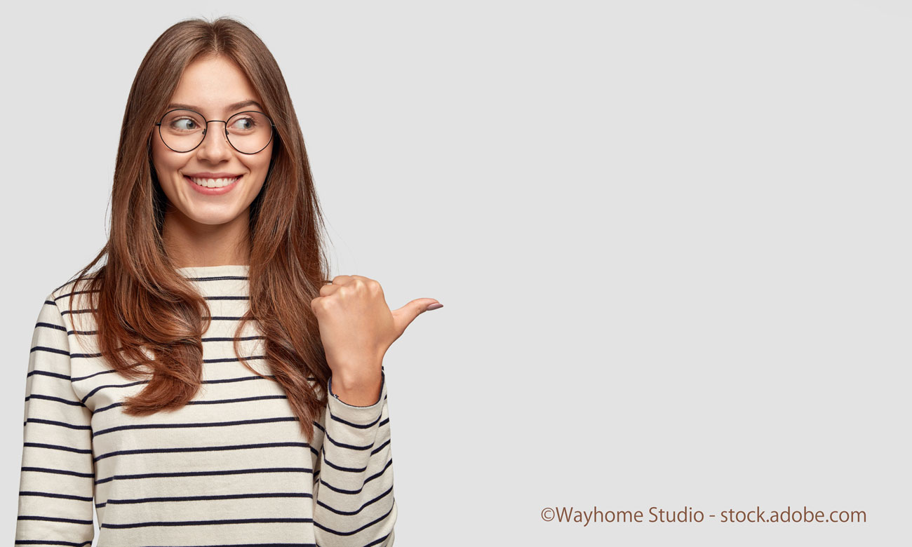 woman points with thumb